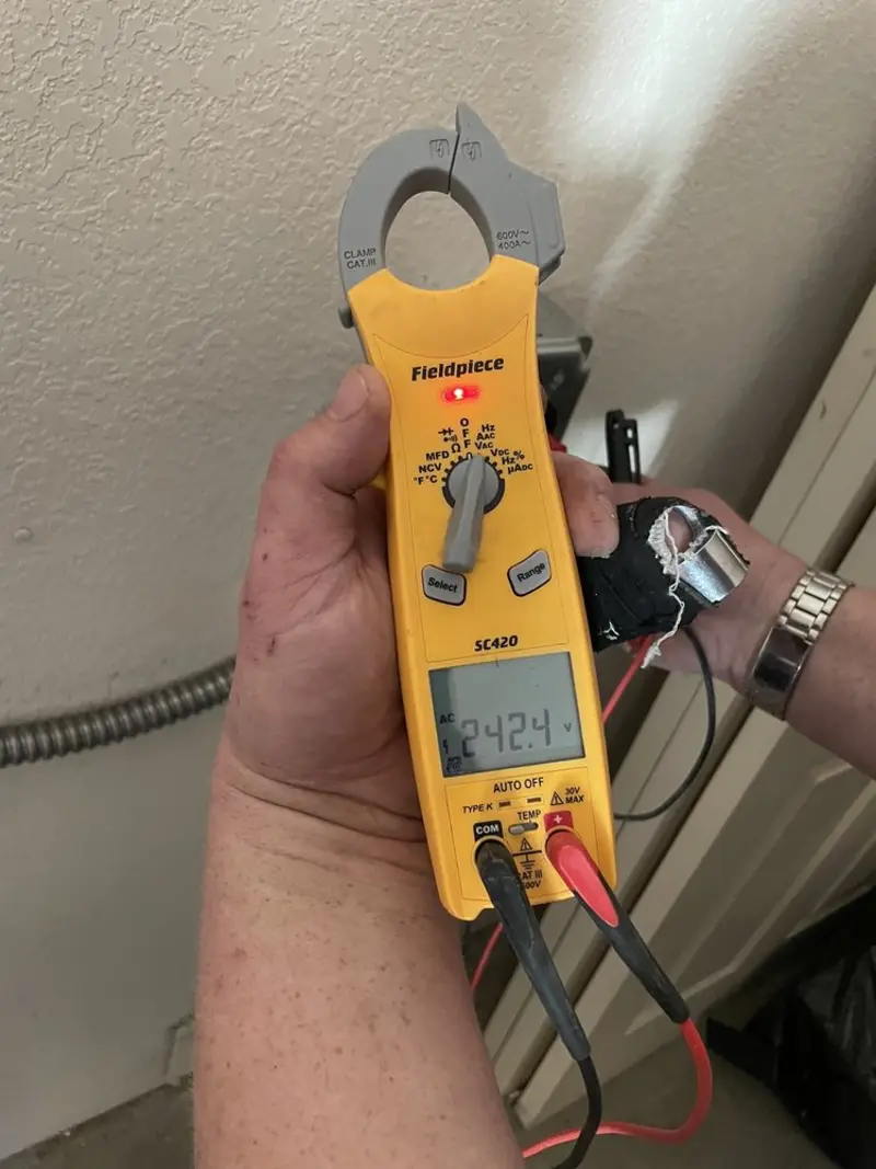 Voltage testing with clamp meter during Generator Installation in Craig